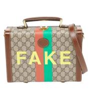 Pre-owned Brunt belagt lerret Gucci koffert