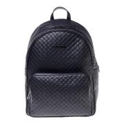 Backpack in black with woven print