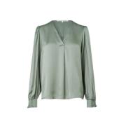 Grønn V-hals bluse med feminine detaljer